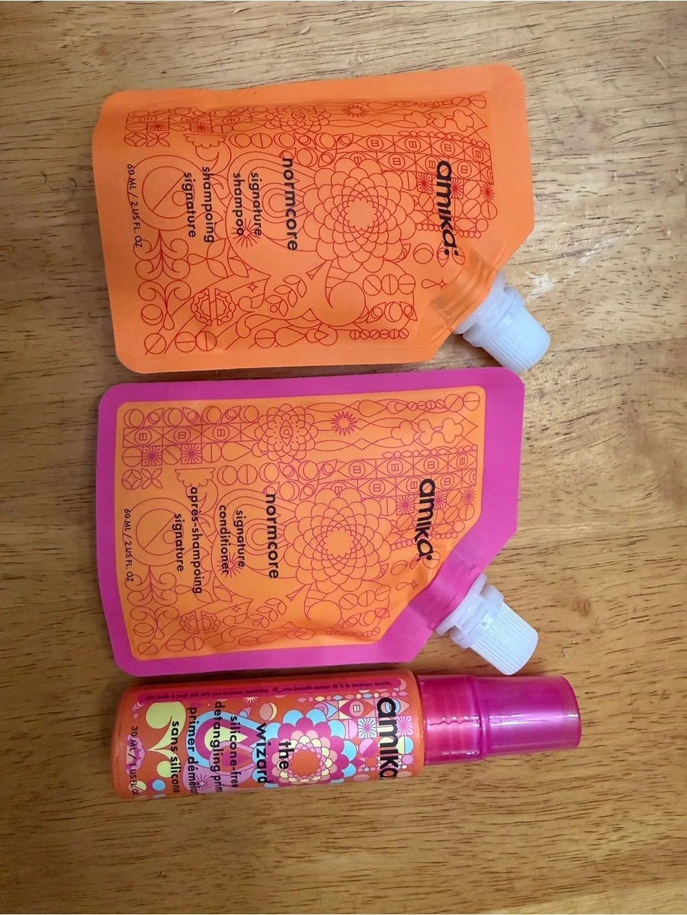 Amika travel size, norm, core shampoo, and conditioner, and the wizard